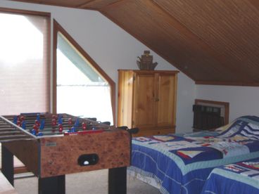 Four bedrooms plus additional sleeping loft; foosball table