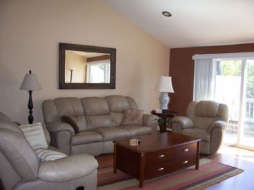 Living area. Leather sofa and loveseat. Entertainment center, fax machine - everything you need.