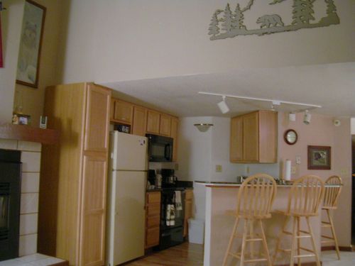Fully equipped kitchen w/stove, oven, microwave, crock pot, electric skillet, pots, pans, dishes and silverware.