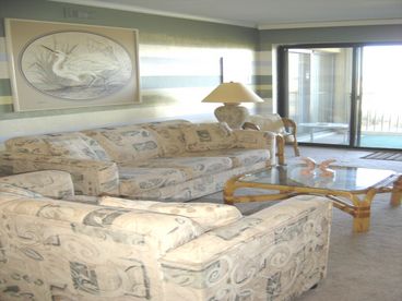 Beautiful and cute living room right off the sand!