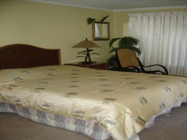 Nicely decorated oceanfront master bedroom. Just open up the window and be lulled to sleep by the sounds of the waves...