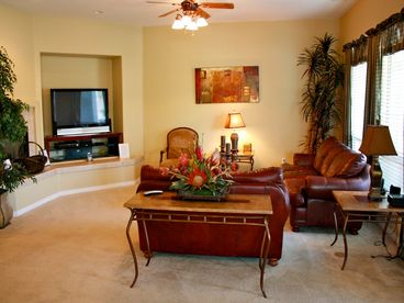 Come in and relax in the Great Room with HDTV, fireplace, soft leather couches.