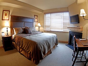 Master Suite 1 has a fireplace, a plasma screen tv, a kitchenette and a private bath with a private entrance and exit