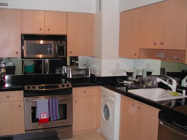 new kitchen w stainless appliances, oven, microwave, dishwasher, small washer/dryer