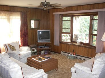Plenty of seating with bay window facing mountain view.