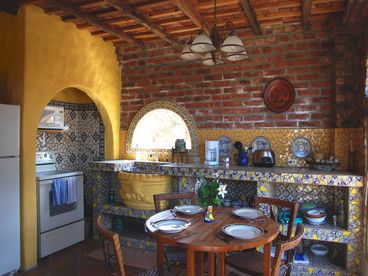 Full kitchen and dining area