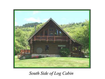 View of the south side with upper balcony. Also a deck to the west and a front porch to the east side with a porch swing to sit with your sweetheart and enjoy the quiet serentiy of the surroundings.