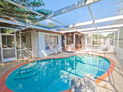 Ease yourself into our heated pool and relax in under our lanai!
