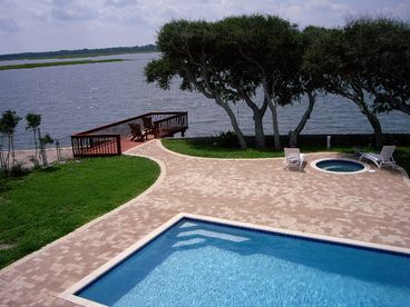This large heated pool and hot tub overlooks the waterway. You will truly enjoy relaxing by the pool with these great views.