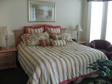 Master bedroom with king bed, adjoining master bath and walk-in closet