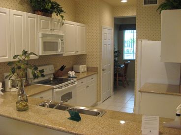 Fully-equipped kitchen with granite countertops