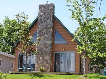 Stone chimney inside and out right on the shore.
