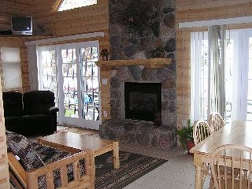 Living room with 2 walk out doors toteh deck.