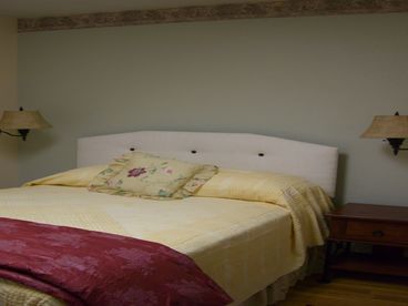 Kate\'s Room - dressed in yellow and green with England photos and simple pleasant decor.