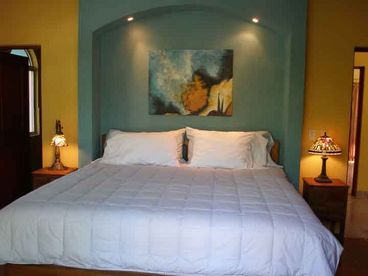 Comfortable and colorful bedroom suites with full baths, and a bathtub in the master bath, onyx sinks, marble countertops