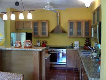 Well-lit gourmet kitchen, fully-equipped for you, or we can arrange a wonderful cook for you