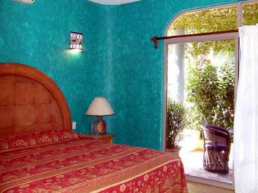 Colorful sunny bedrooms with king beds and terraces, full baths