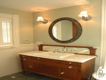 Oversized  boutique bath upstairs features claw foot tub, shower, and a walk in closet. Large windows allow for lots of natural light.