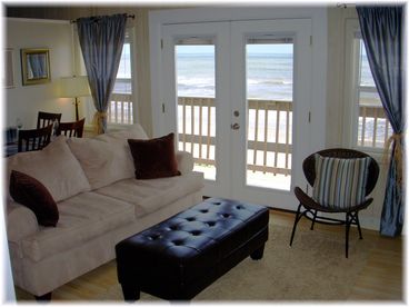 Relax on the comfortable living room furniture while taking in some of the best beach views available.  Sofa is a queen sleeper.