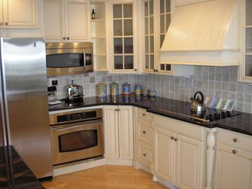 A gourmet kitchen with stainless steel applicances.
