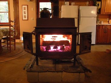 The vintage wood burning stove heats the whole house