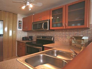 full kitchen and laundry, fridge with ice maker, another fridge in the penthouse second level