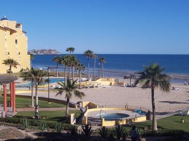 View from condo balcony of resort and beach