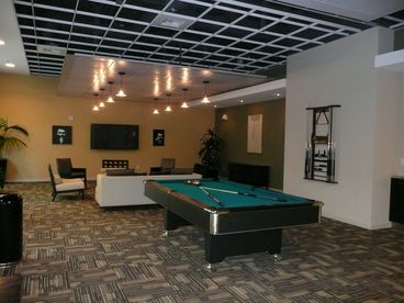 entertainment center with flat screen plasma tv, beautifully furnished, pool table.