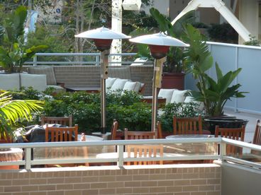 Great outdoor patio with dining tables, and bbq grills.