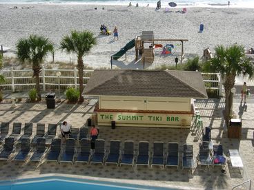 Tiki Bar, Kids Playground, Pool Deck, Pool and Beachfront View Above Palm Trees
