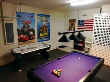 The games room has a 8ft slate bed pool table,  and an air hockey table.