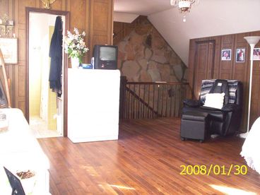 Gateway Suite bedroom looking from the far wall towards the bathroom (left) and the stairway to the livingroom.