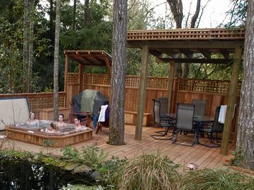 hot tub and outdoor dining area