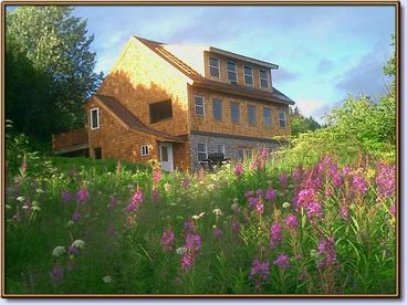 The Bear\'s Den is a timber frame lodge with views of the Homer Spit, Bay, Glaciers and beautiful wild flowers.