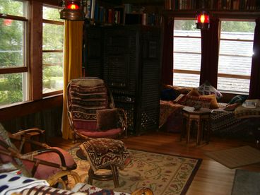 Living room with antique nautical lamps & oriental rugs