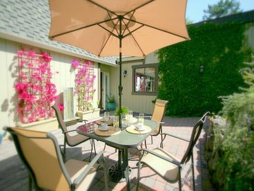 Secluded and private front patio area with lawn and deck.