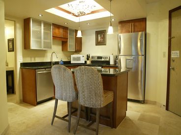 Kitchen with new cherry cabinets, granite counters, and stainless steel appliances