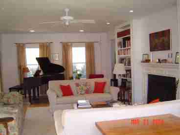 Spacious Living-room with Baby Grand Piano and Fireplace