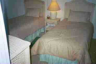 This Bedroom has Twin Beds a very nice set up. There are closets in both bedrooms.