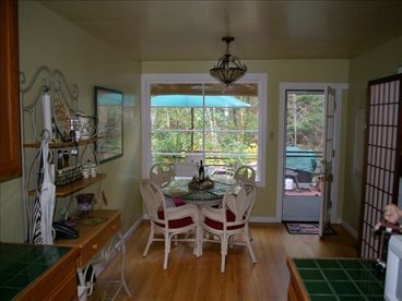 Fully equipped kitchen overlooking the creek; we supply everything you need to prepare your masterpiece, or just have coffee; Gas BBQ on rear deck too.