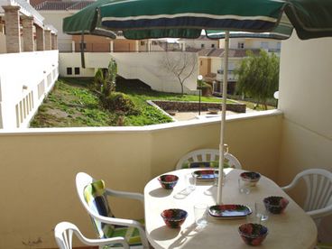 Balcony: Sunny balcony off of lounge furnished with patio table and 6 chairs and two sun loungers (cushions are provided for chairs and loungers). 