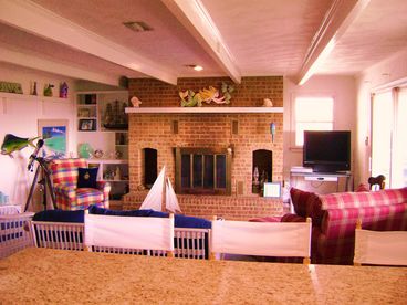 Spacious great room with fireplace.  Faces ocean.