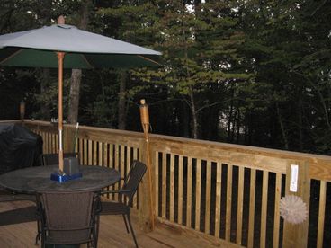 Spacious deck overlooking lake for entertaining