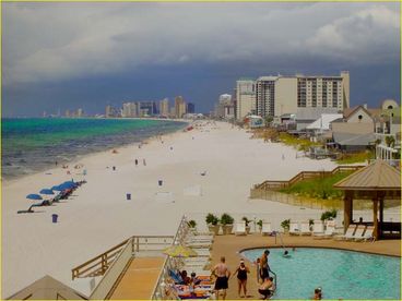 Huge pool deck, heated pool, Gazebos, lounge chairs great view of the beach.