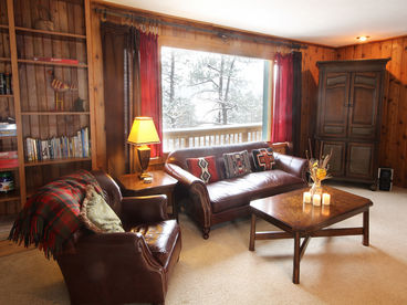 Bright, spacious and comfortable living room.  Sliding doors to the deck where the grill and hot tub await!