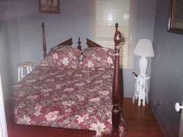 This is one of the bedrooms on the lower floor. All of our bedrooms are provided with professionally cleaned linen. Upstairs is a loft with 3 beds as well, great for families with children for their own getaway!