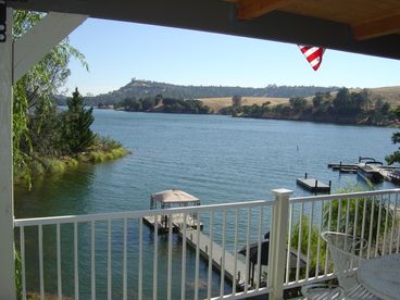 View of lake from deck and house