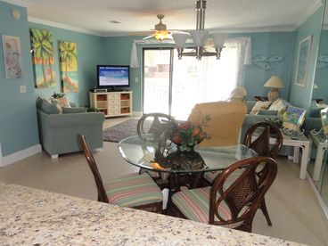 Spacious living room & dining area at 203 St. Katherine.  This townhome is 1,200 sq. feet with 2 bedrooms and 2.5 baths.  Living room features a new 55\