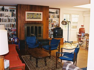 Sunny and large living room with dining area or game table, skylight