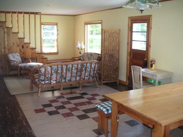 Front of the cabin is a shared living and dinning area which a huge table that seats ten and a cozy seating area for reading or games.